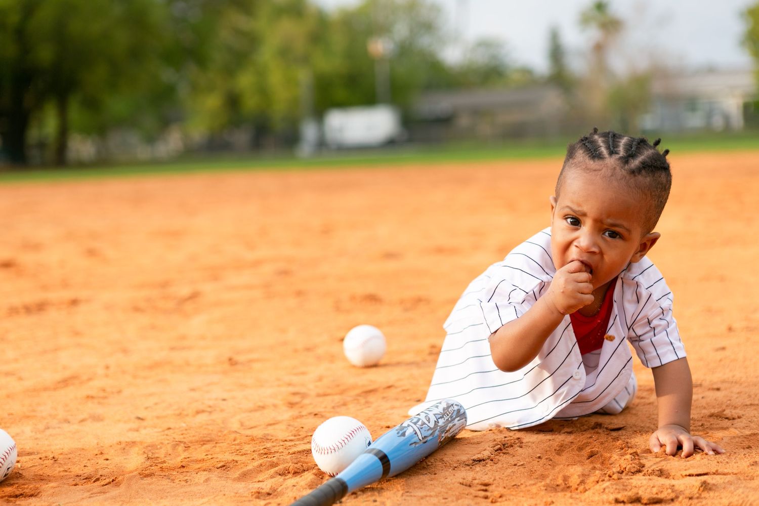 Sanford FL Cake Smash Photography boy on the baseball field for his first birthday