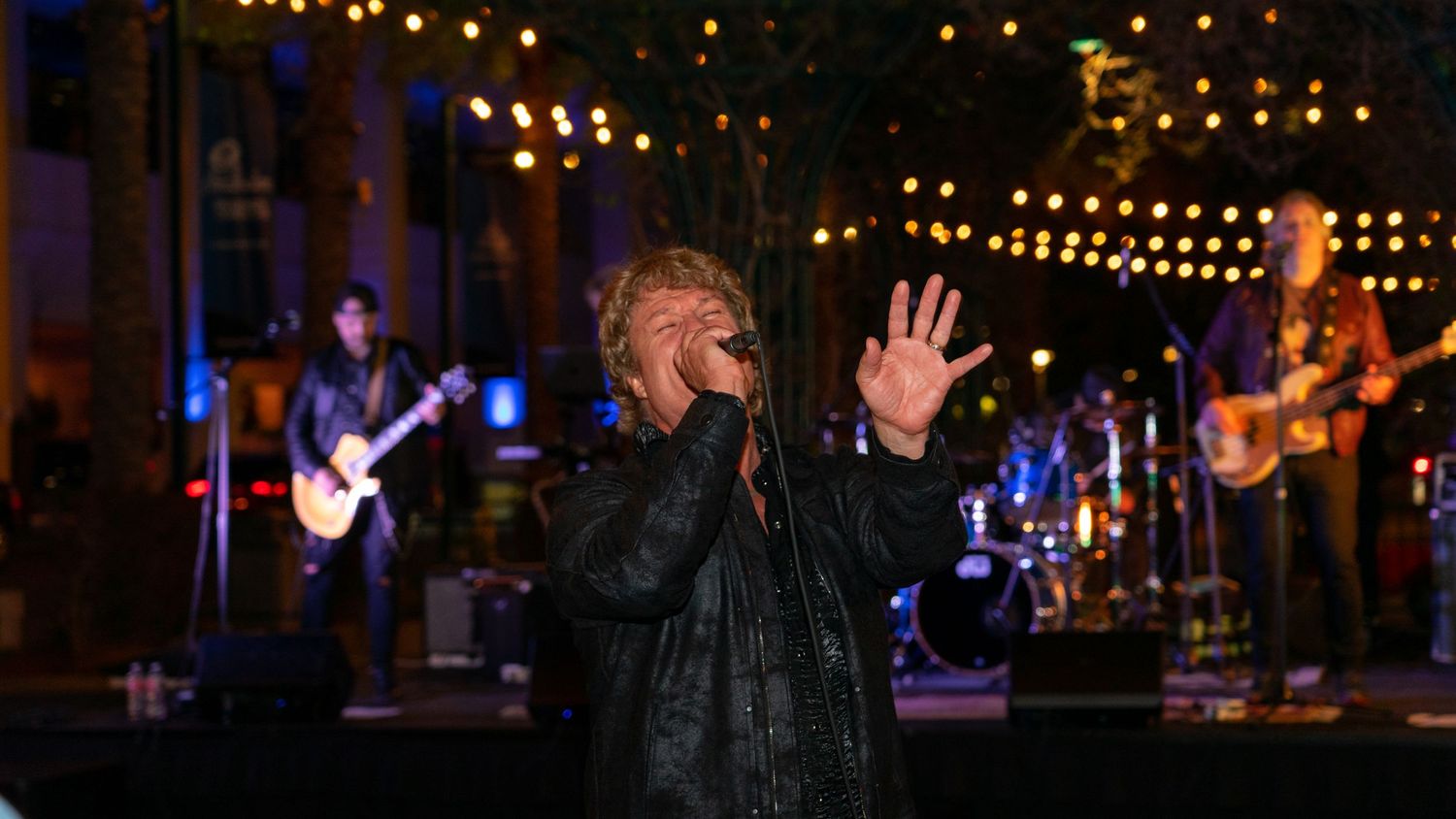 Man singing into a microphone