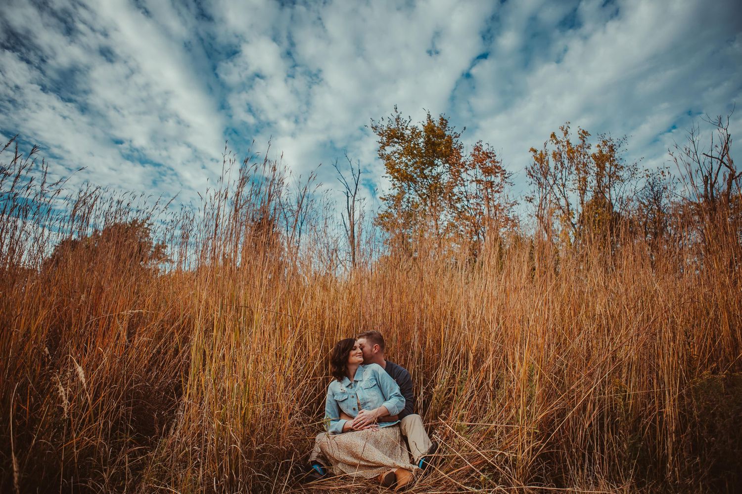 engagement photos in tall grass cute couple
