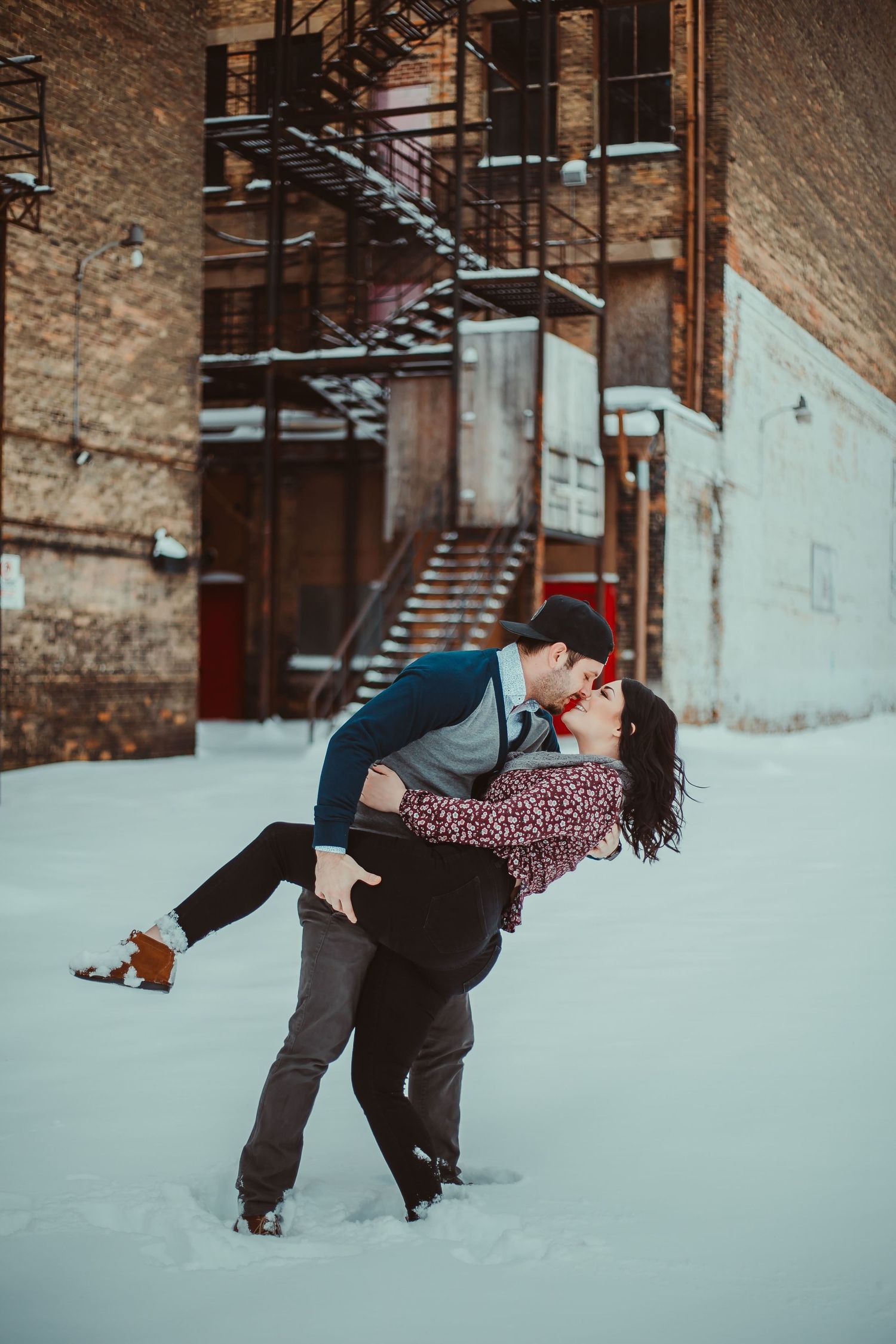 couple in snow doing a dip