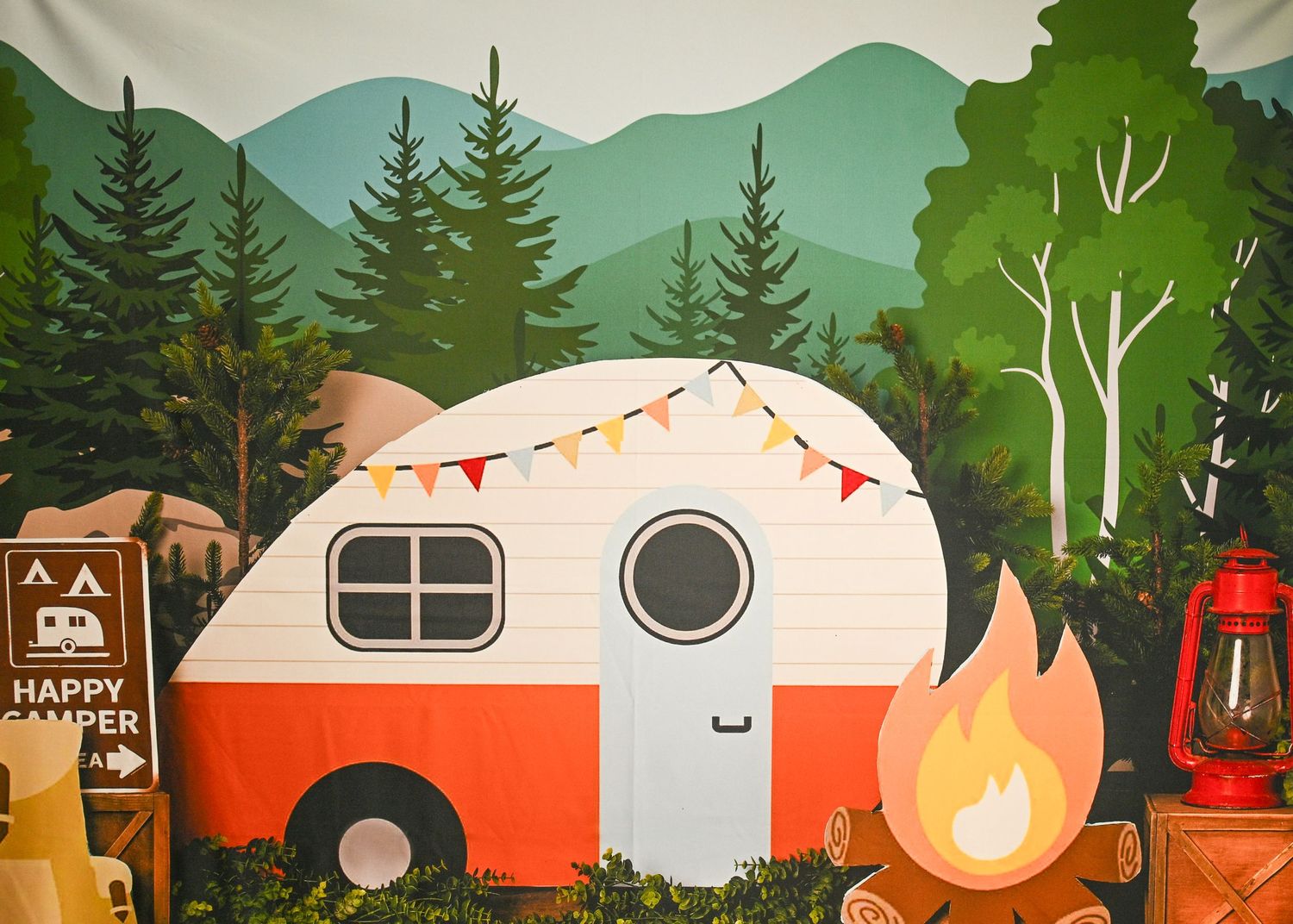 Illustrated camping scene with retro campers, pine trees, and mountains in vintage style.