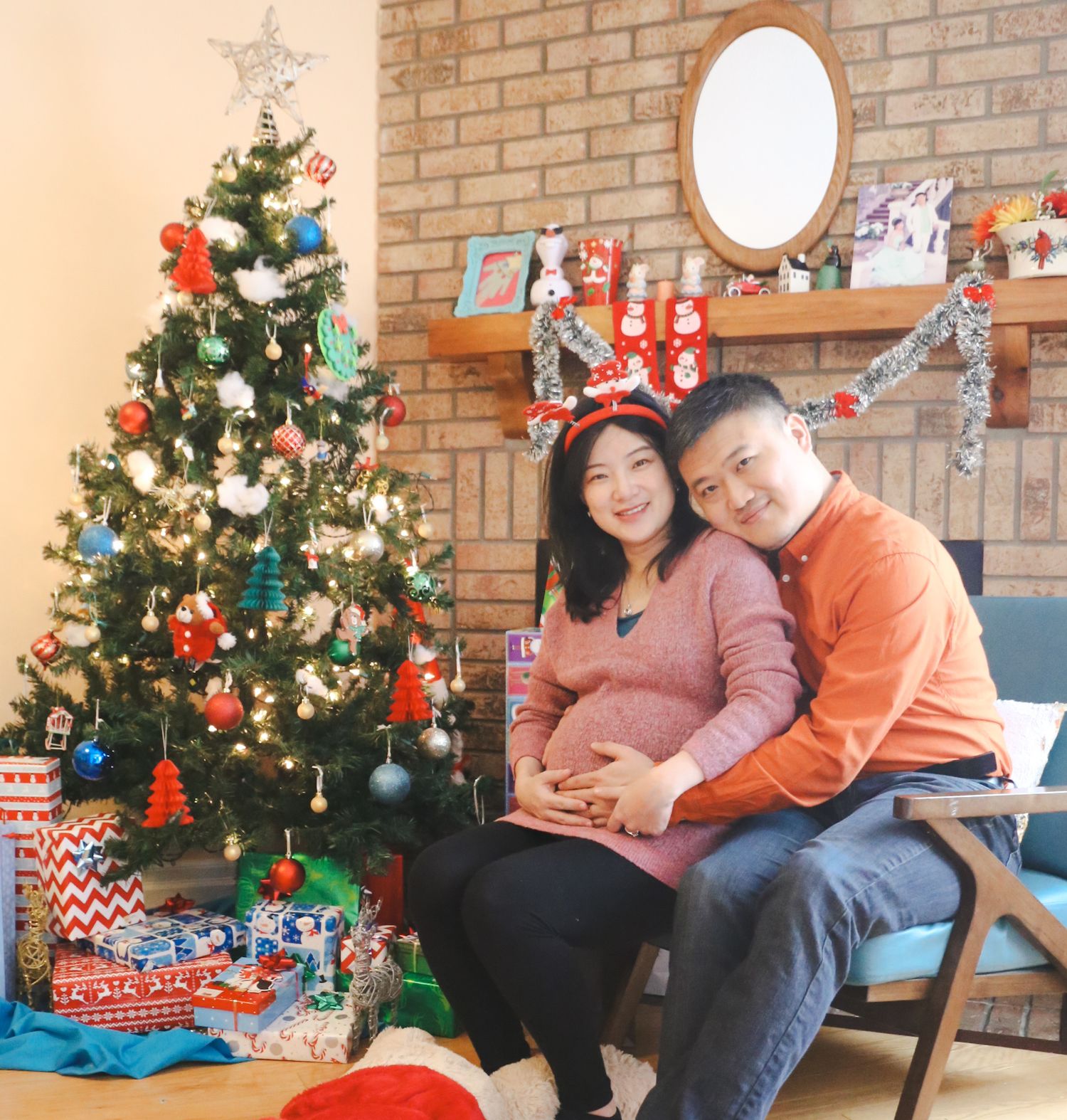 A festive Christmas scene with decorated tree and wrapped presents in a cozy brick-walled room.