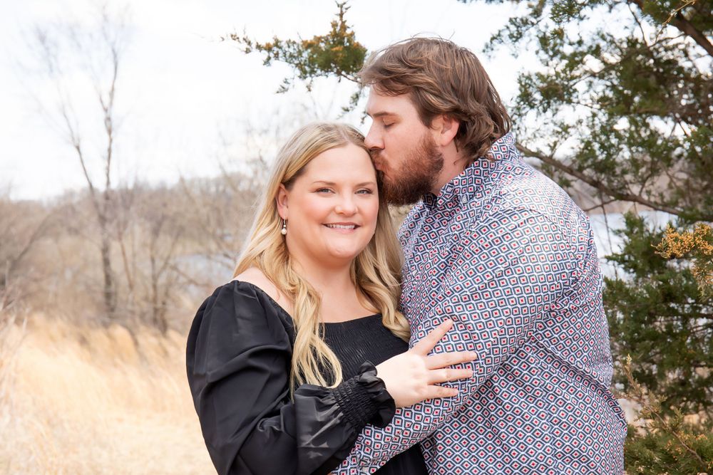 Intimate portrait of a couple embracing during an outdoor photo session.