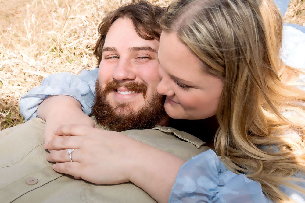Intimate moment captured between couple during outdoor photo session.