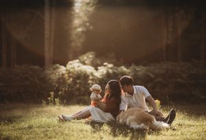 "Family photographer capturing a happy and united family moment."