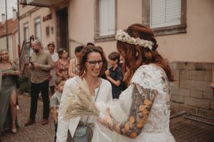 Wedding guests celebrate and interact outside during the reception.