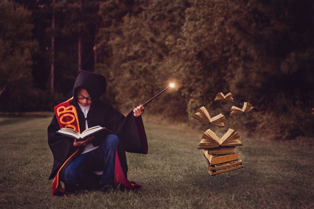 composite image of youth boy using magic to make books float for House Gryffindor in Houston, TX