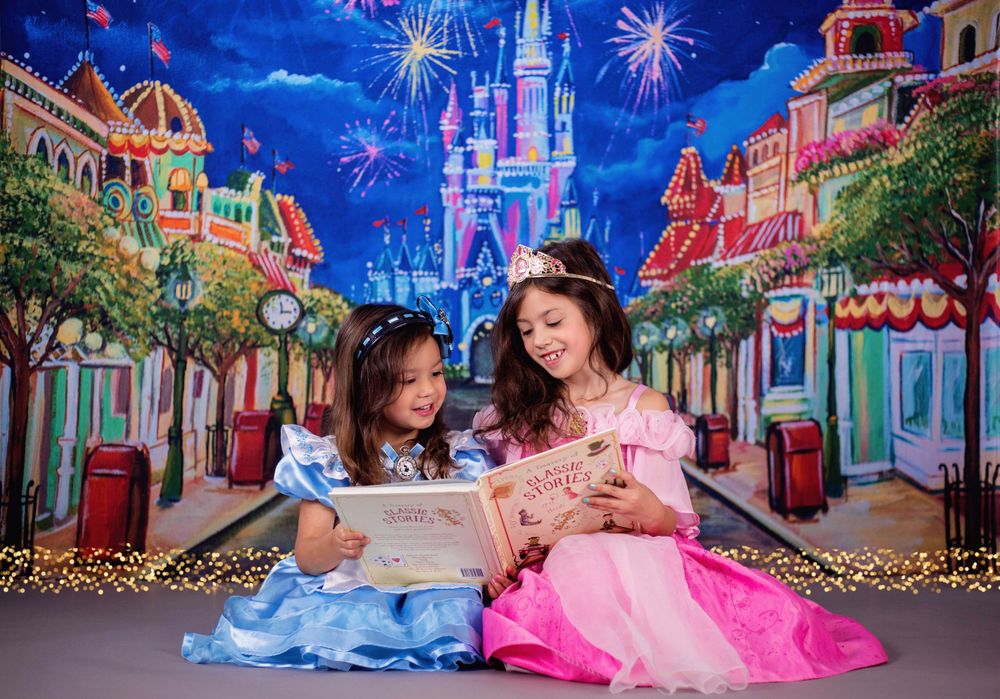 Princesses reading storybook on Disney World's Main Street set at Little Fox Photography in Houston, TX