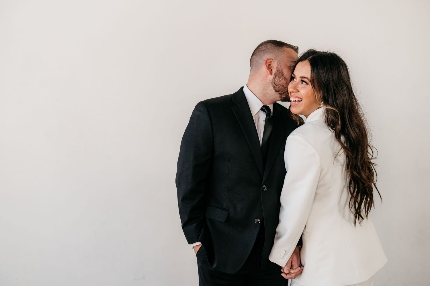 Engaged man and woman in Houston photography studio.