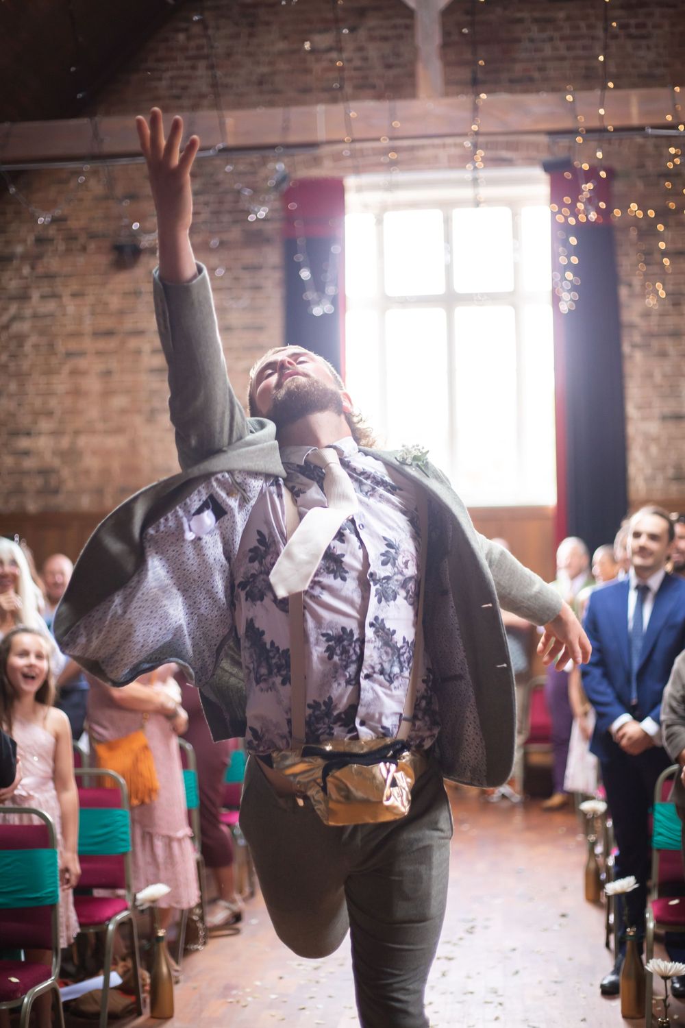 flower man walking down the aisle