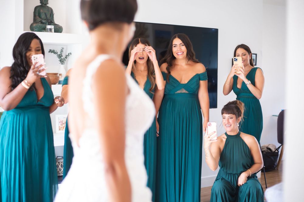 bridemaids seeing bride in dress