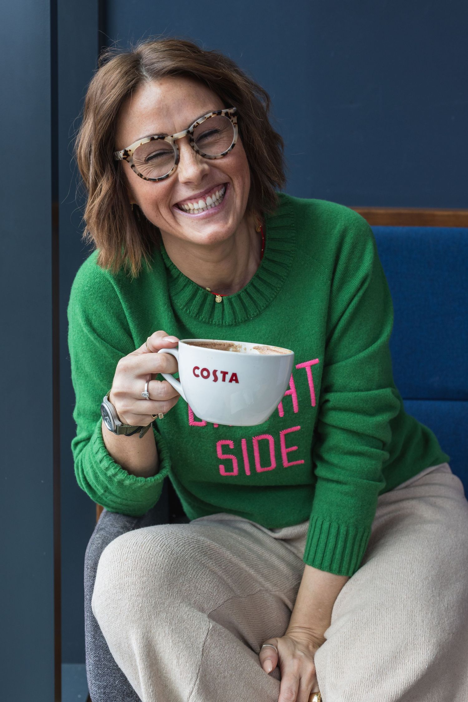 Influencer model sat in costa enjoying a coffee as part of an influencer marketing ad campaign for instagram in Brighton