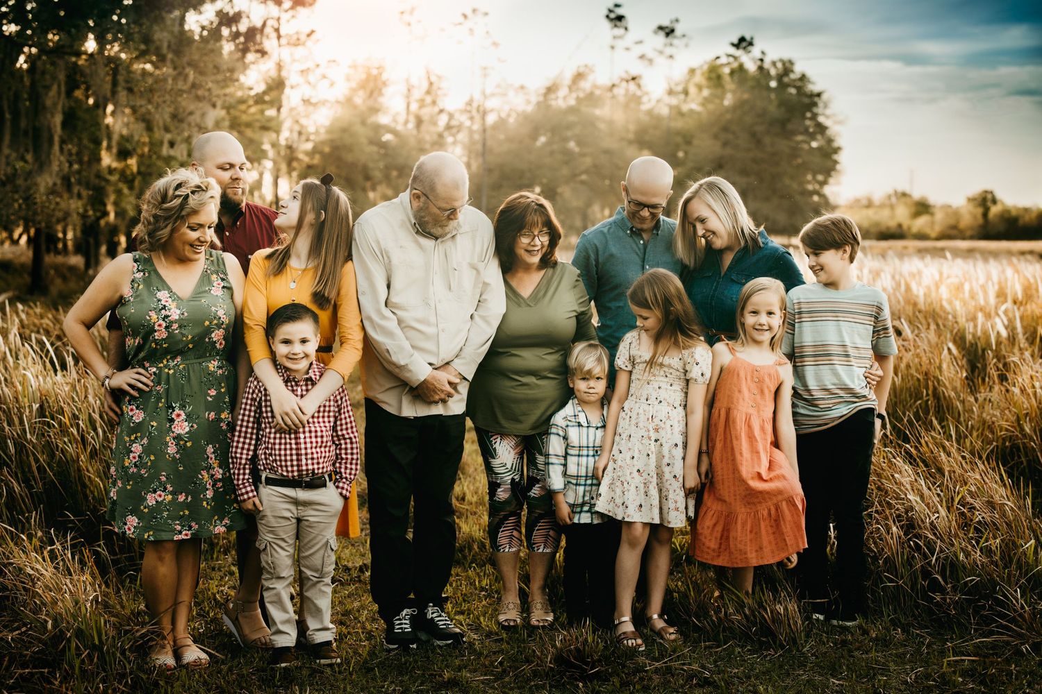 Lakeland Family Photographer- Big family smiling and looking at each other