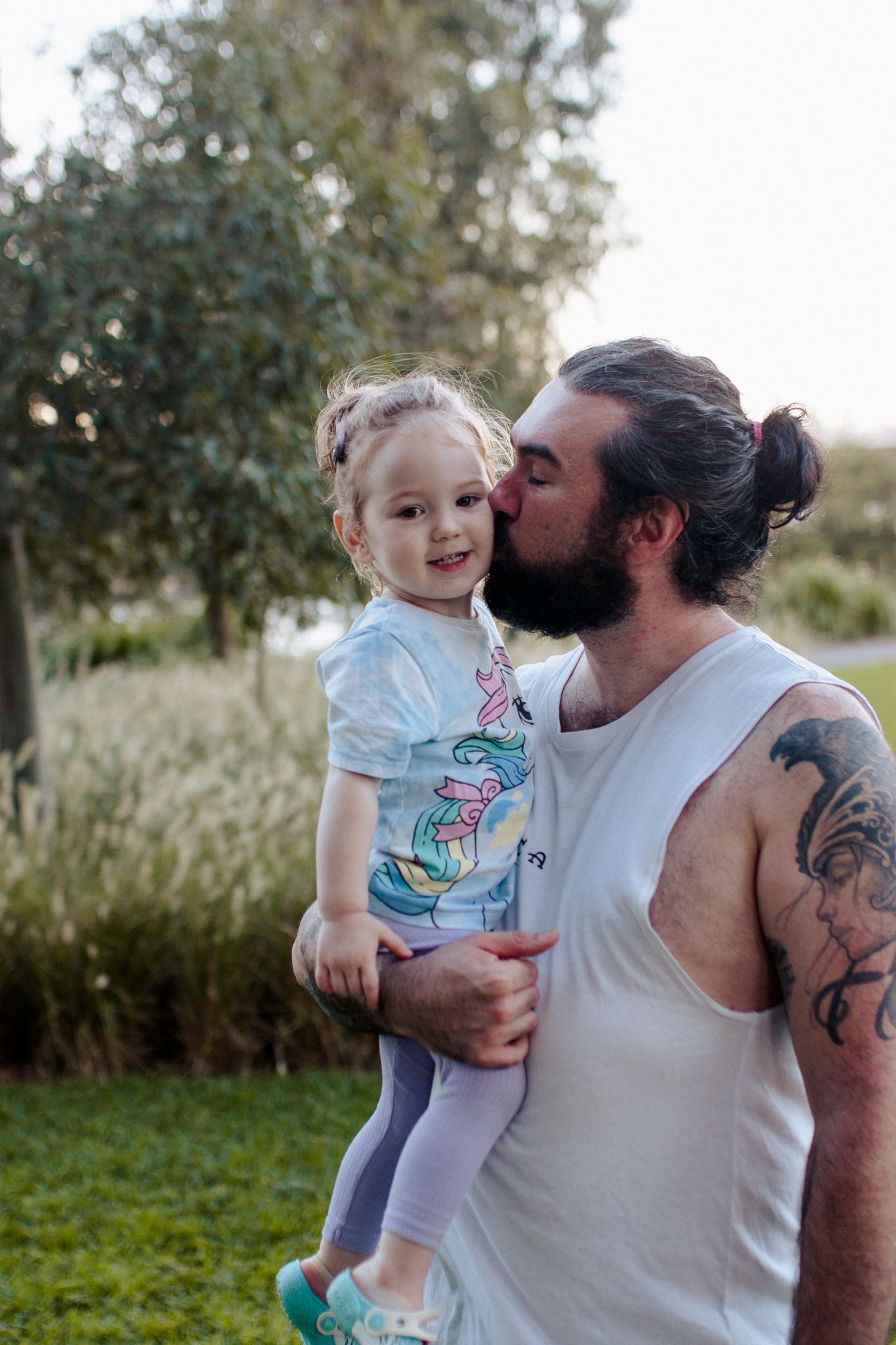 Father and daughter kiss