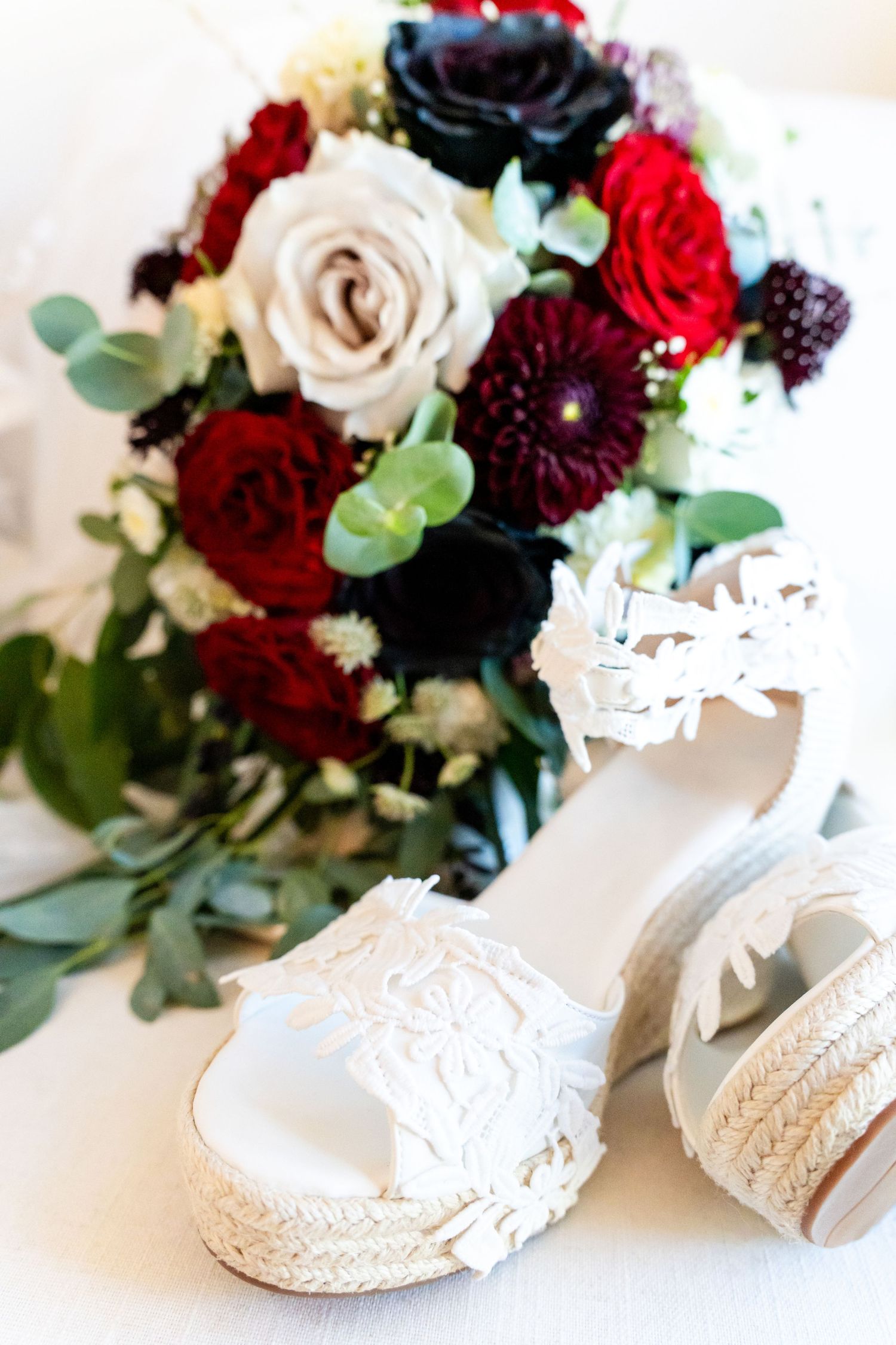 bride's bouquet with white bridal shoes