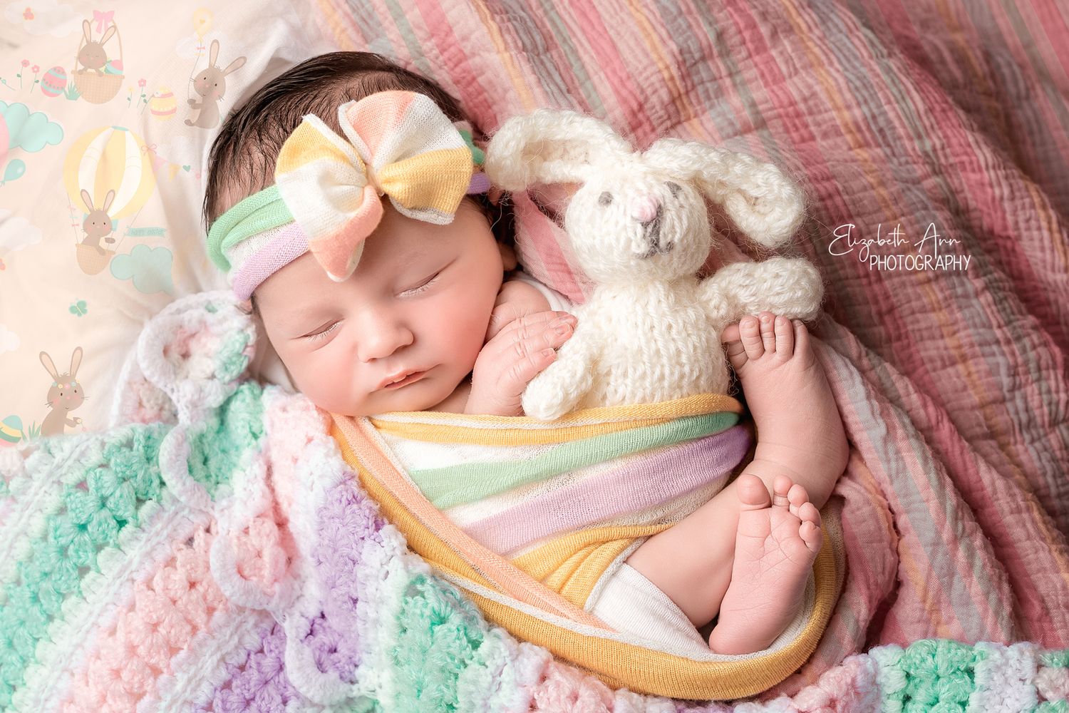 Easter themed portrait of newborn baby with knit bunny and pastels; Elizabeth Ann Photography Wisconsin