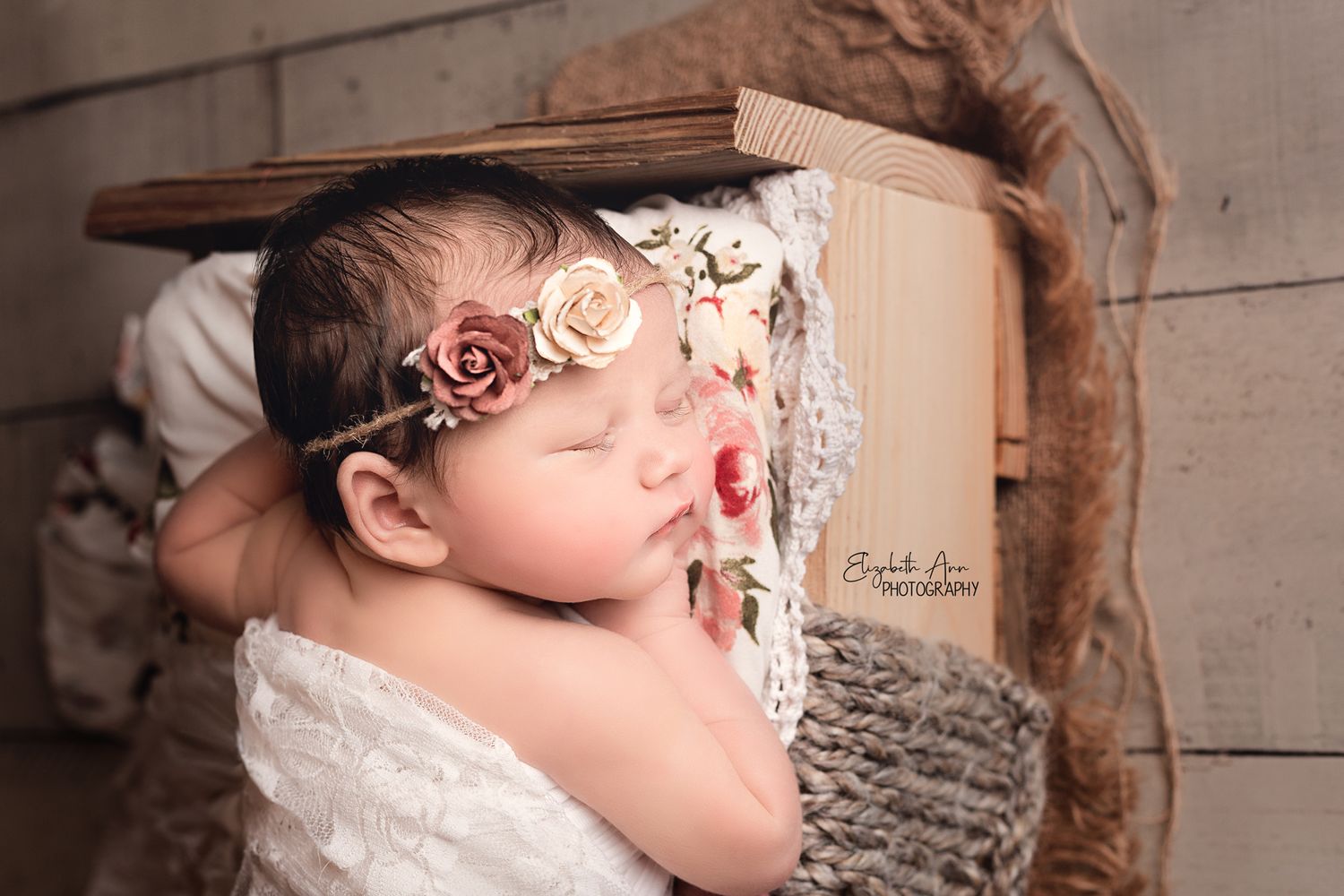Newborn baby girl sleeping on a wooden bed, burlap, floral, lace, rustic; Elizabeth Ann Photography Wisconsin