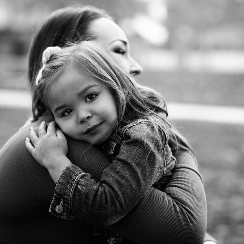 black and white photo of mom and daughter hugging, Elk Grove family photographer, Sacramento family photographer near me