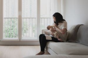 Natural light lifestyle family photography in bright modern living room.