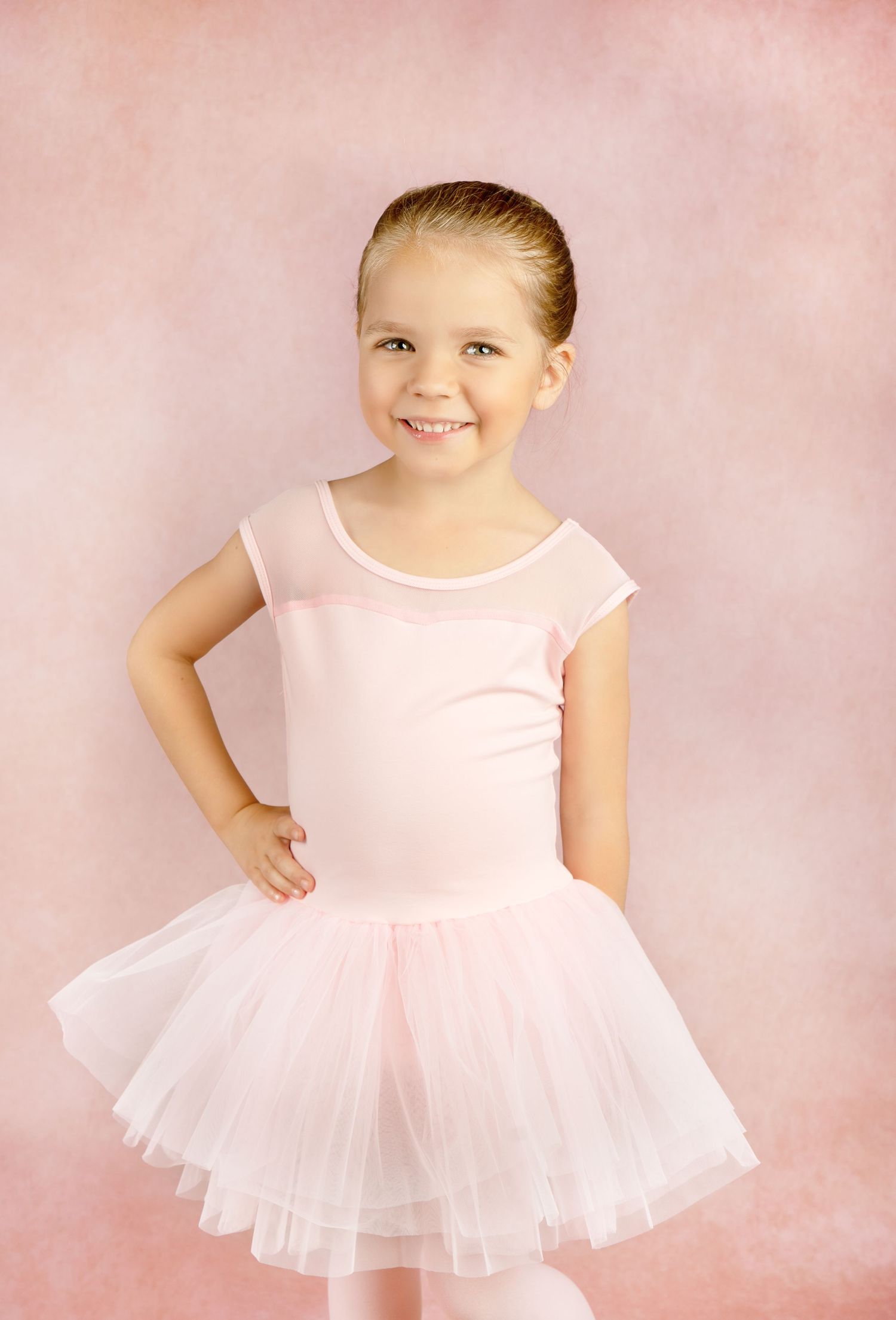 beautiful ballerina poses for studio portrait