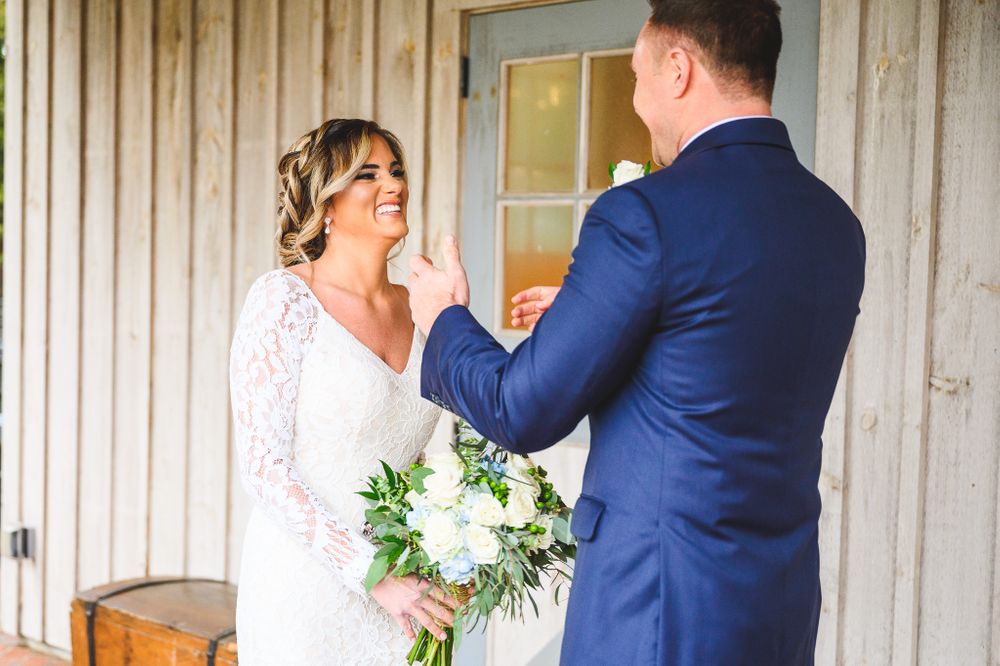 bride and groom laughing during the first look