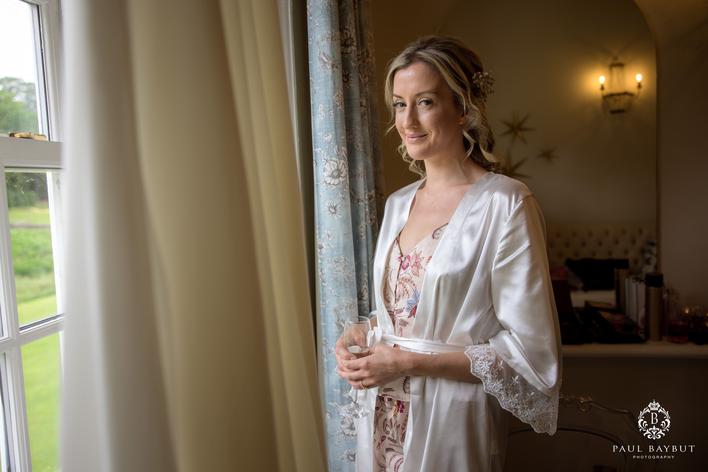 Elegant morning preparation scene by a window with soft natural light.