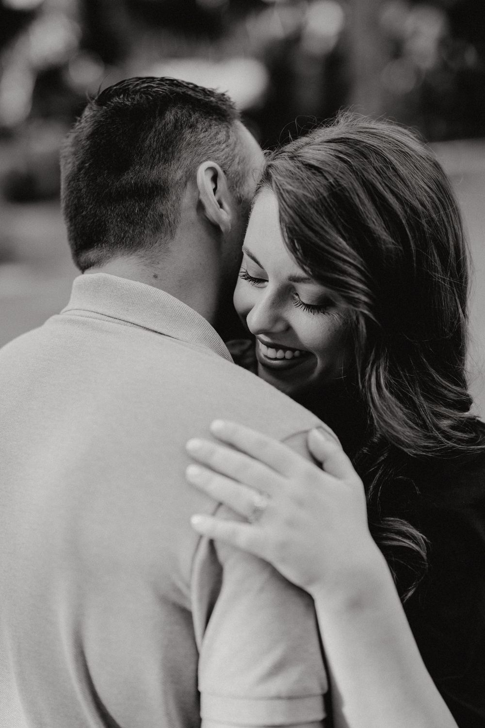 Wife giving a loving hug to husband