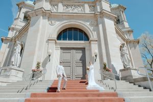 Bride and Groom posing in front of church