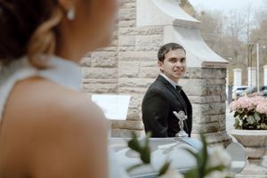 Groom looks at Bride while Bride is looking elsewhere