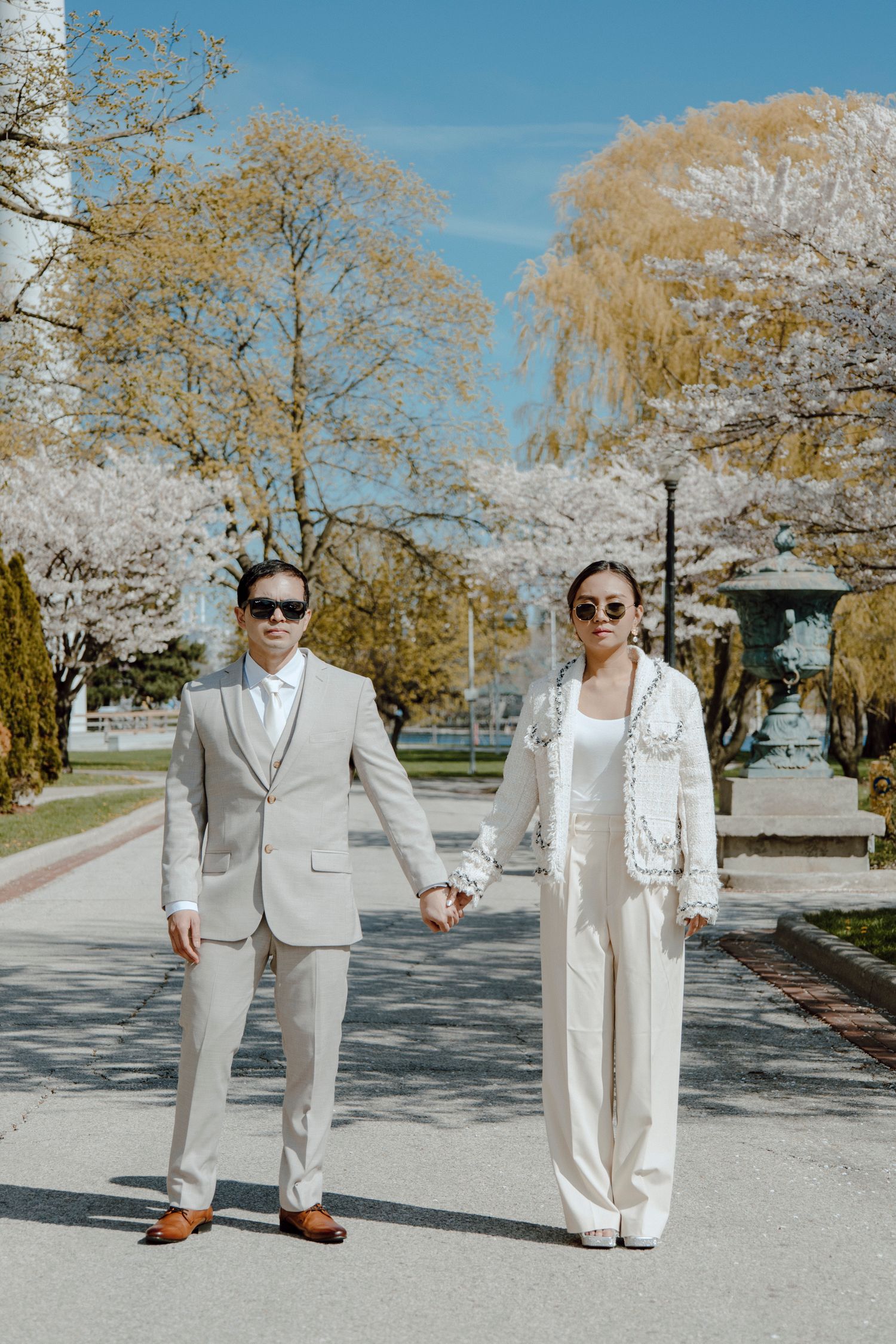 Bride and Groom looking towards the camera while holding hands
