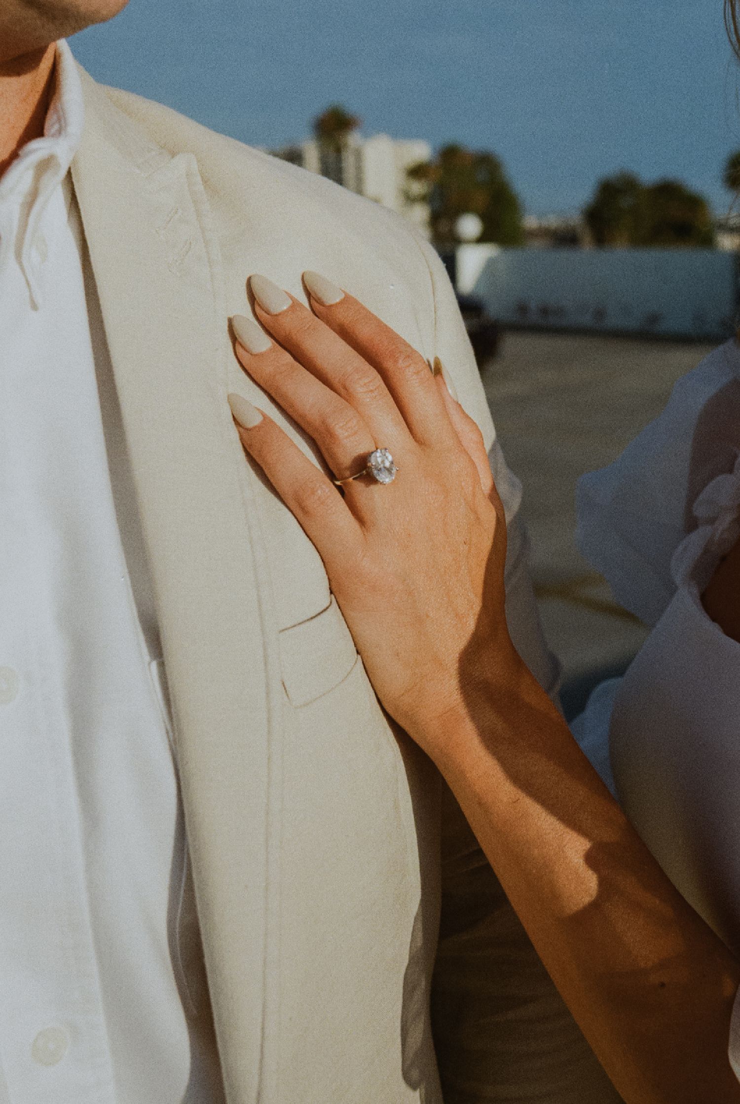 35mm film photo of fun bridal themed engagement shoot on roof of parking structure in Lido Marina, Newport beach