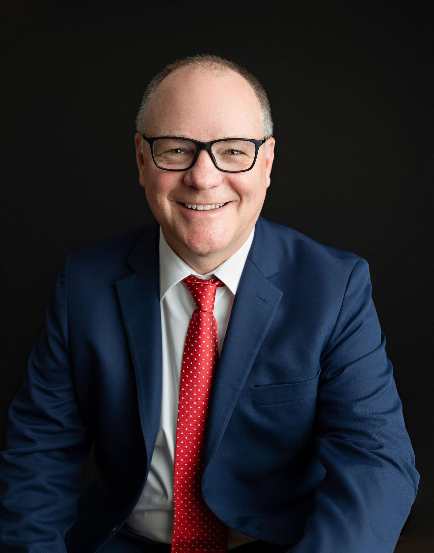 A professional headshot with a male wearing glasses. Greenville SC Boudoir, Easley SC Boudoir, Upstate SC boudoir