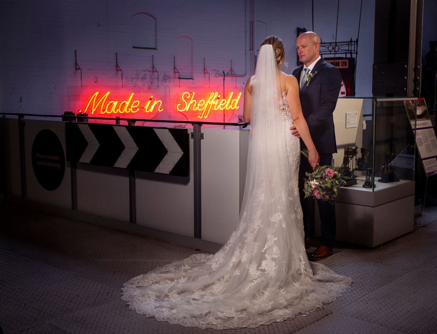 wedding photography gallery at kelham island museum with neon sheffield sign