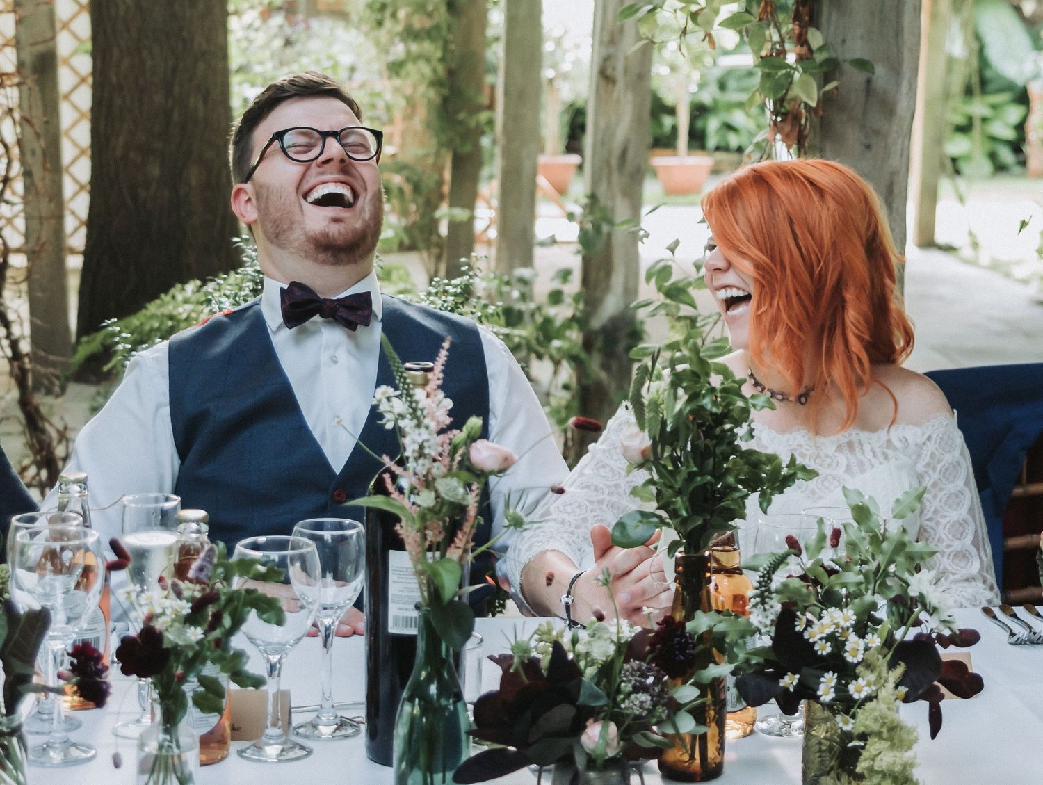 Bride and Groom laughing during their Wedding Breakfast