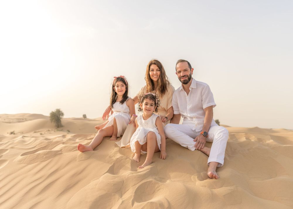 family photoshoot in desert with white and neutral colour clothing