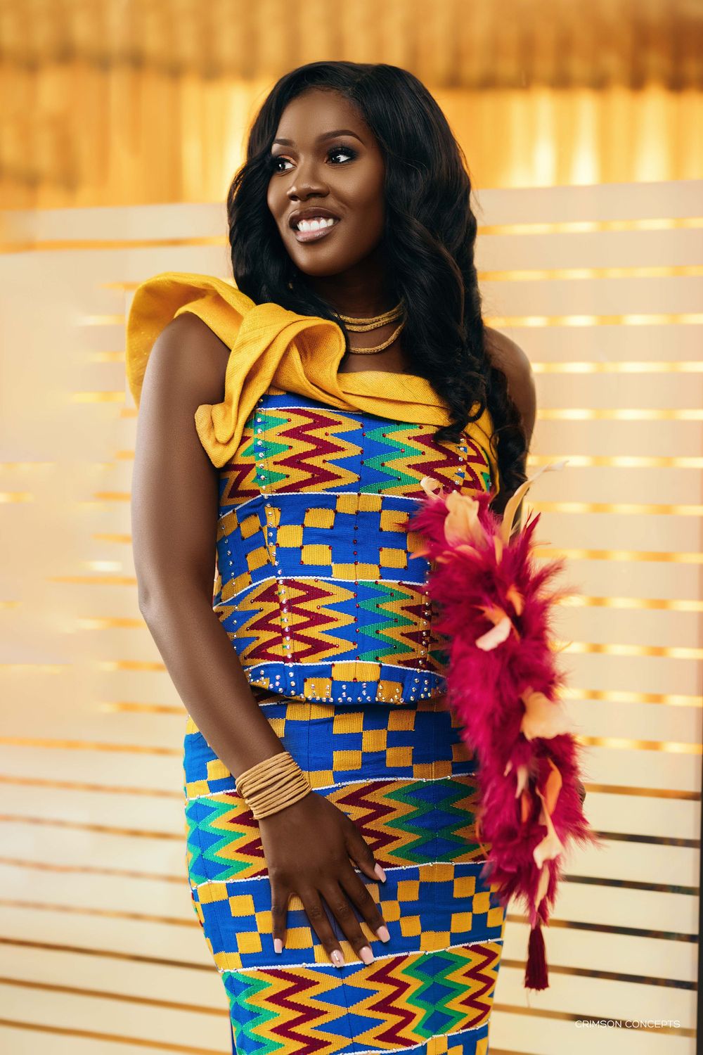 photograph of a beautiful bride in her kente outfit