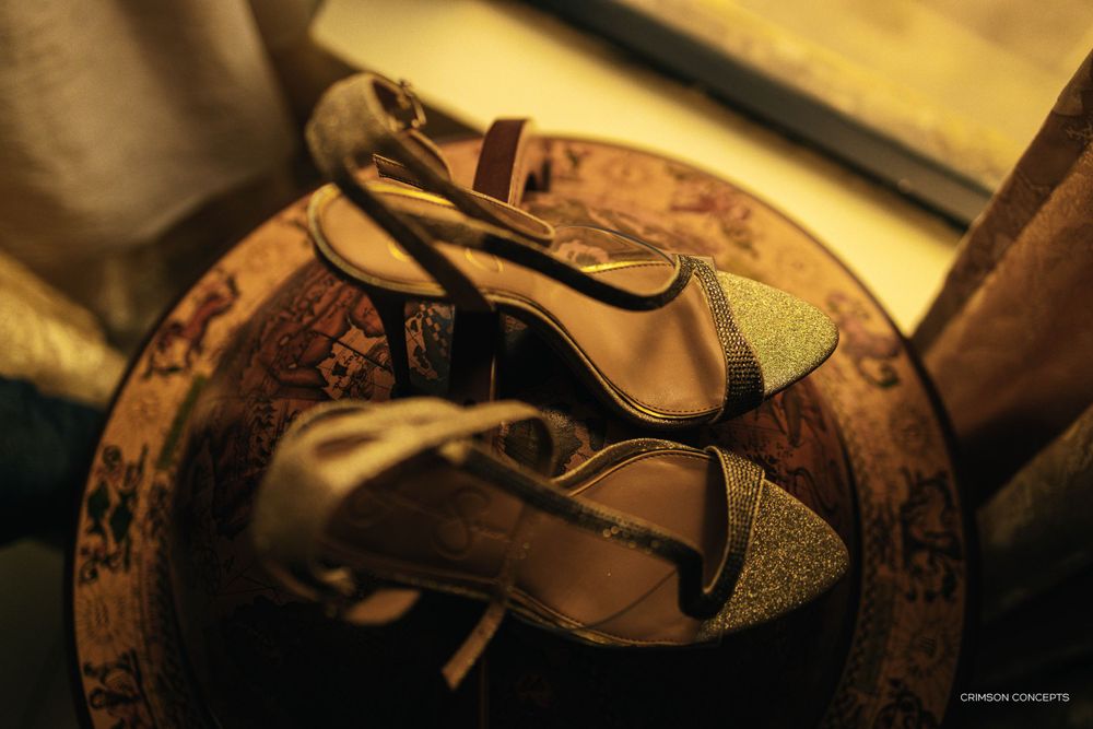 Brides beautiful shoes on a globe