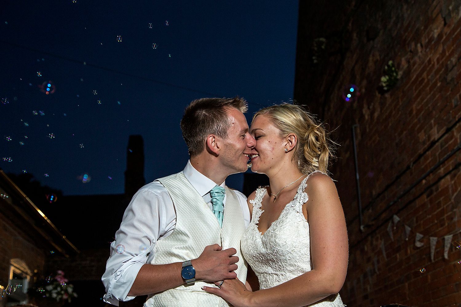 bride and groom close together wedding photography