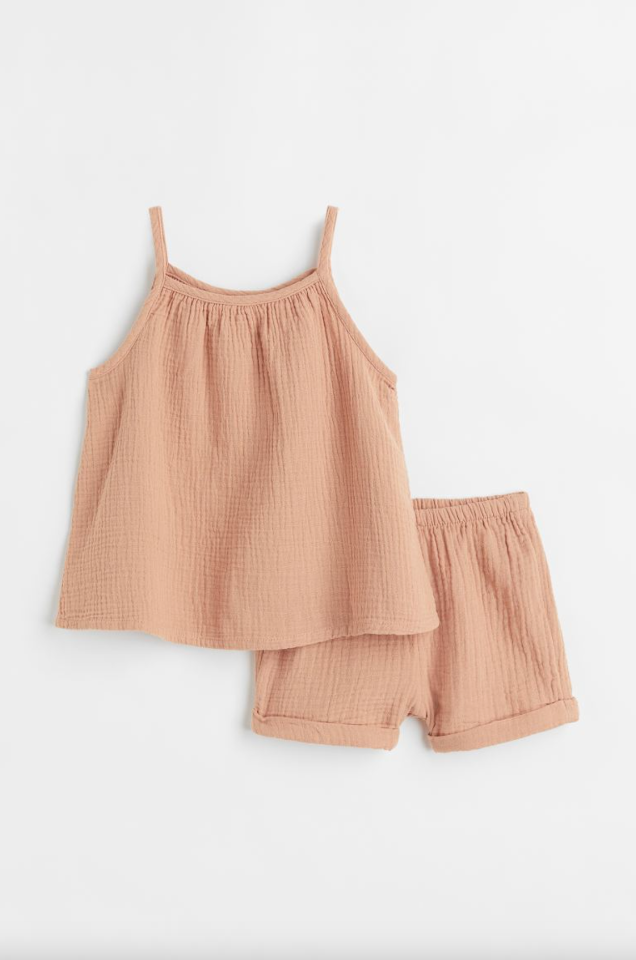 Ferskenfarvet bomulds to-delt sæt med tanktop og shorts til børn.