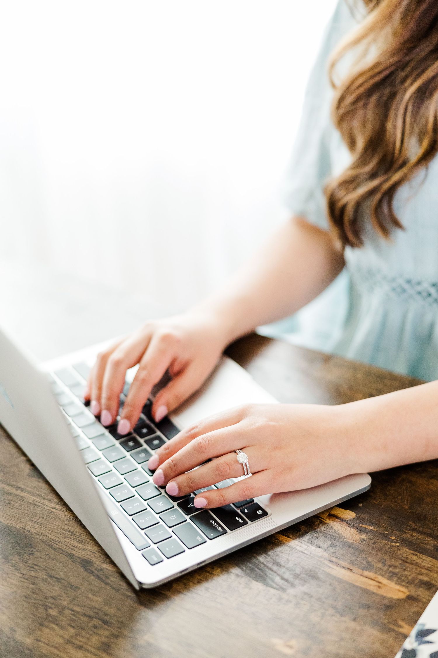 Emmalee Grace Photos typing on a computer