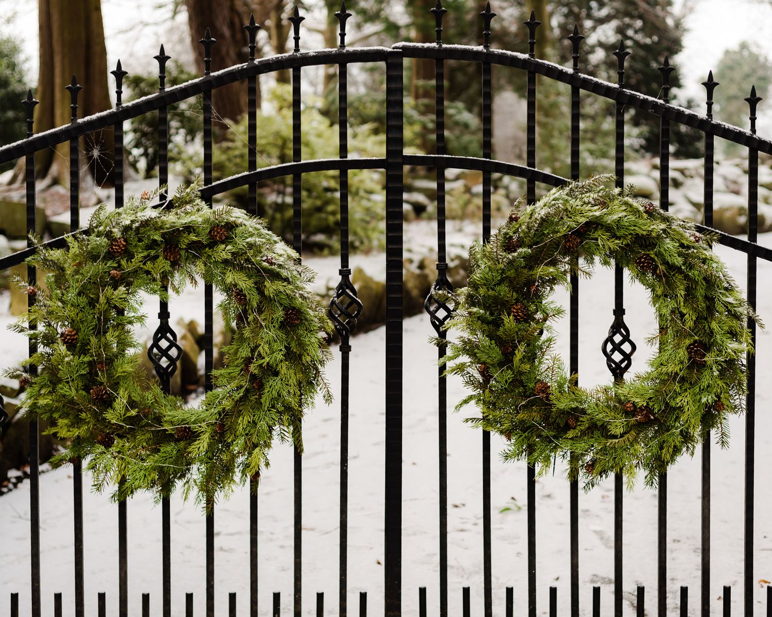 festive wreaths on iron gate, exterior airbnb photos, cozy, seasonal