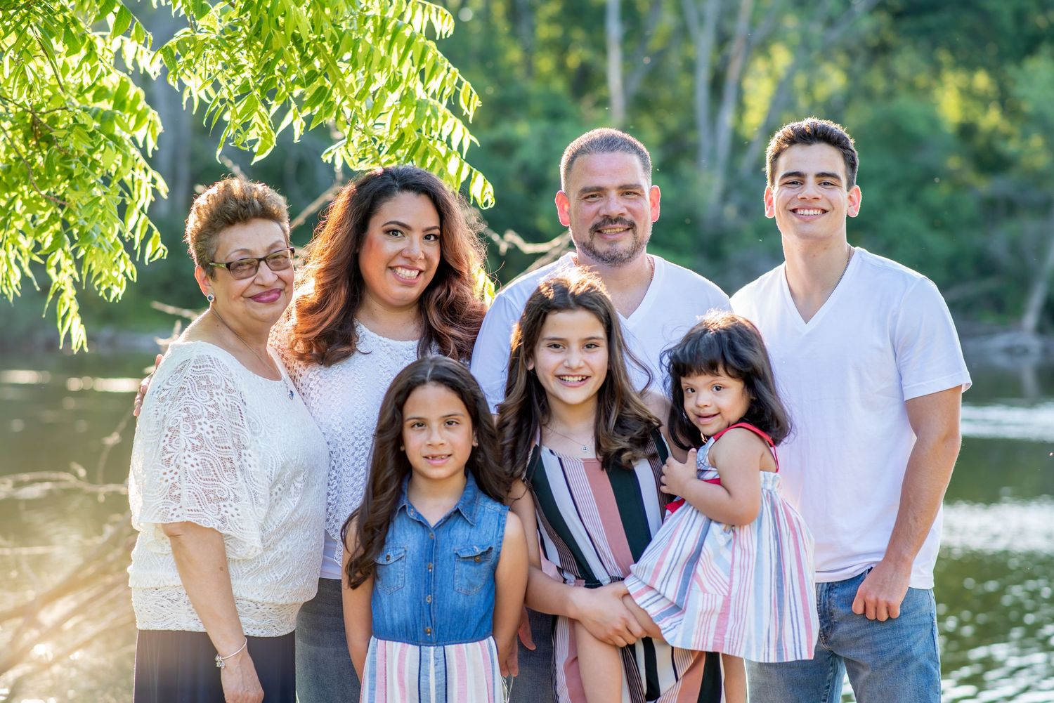 family summer sunshine joy love together river sunset photo down syndrome