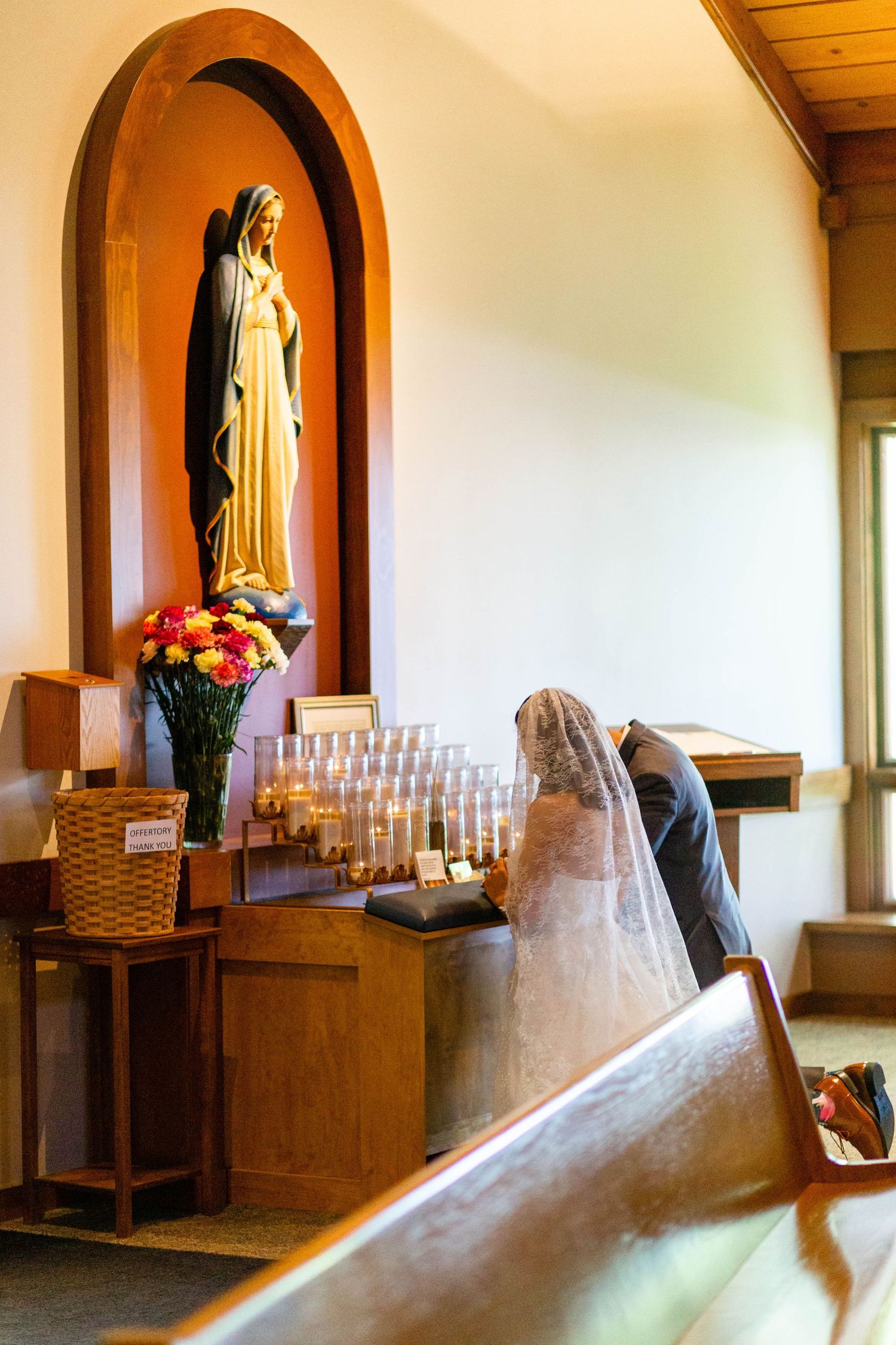 bride and groom kneel at a cleveland, ohio wedding
