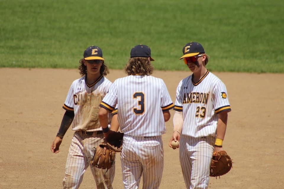 baseball players in group huddle