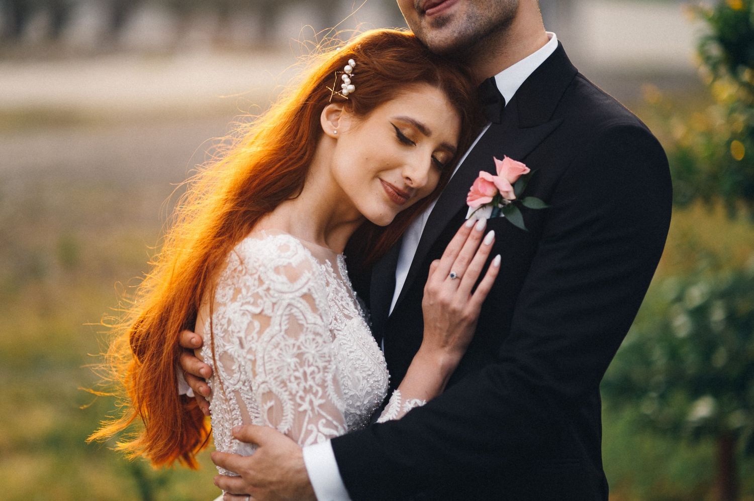 An intimate wedding portrait moment captured in warm evening light.
