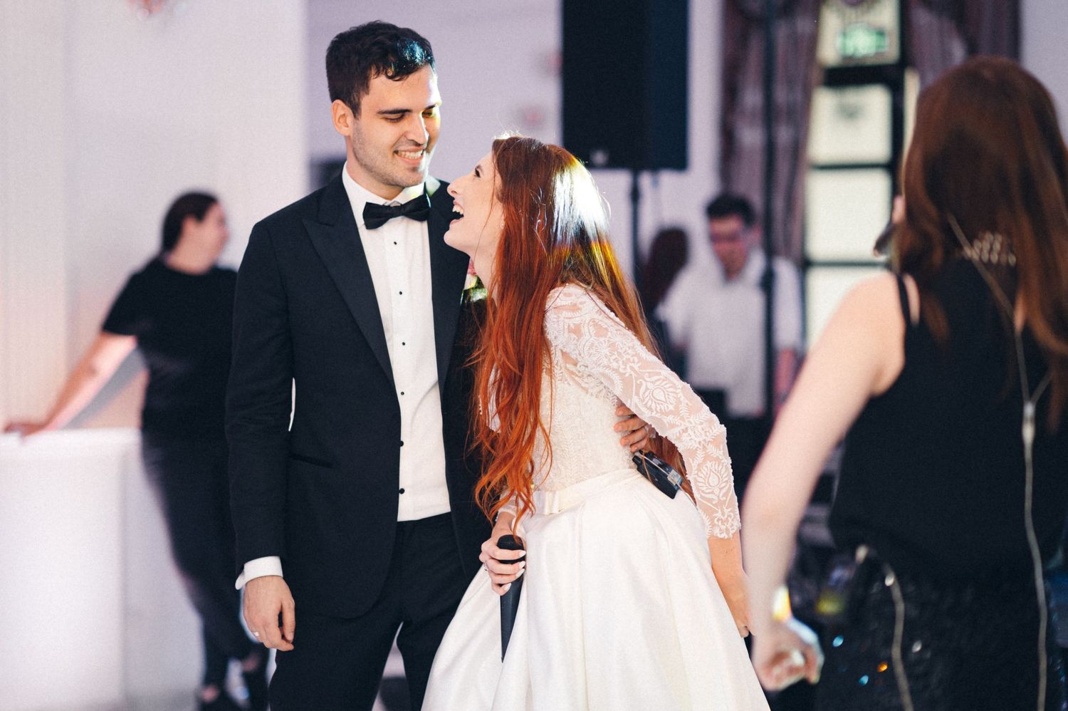 Elegant dance scene at formal event with performers in eveningwear.
