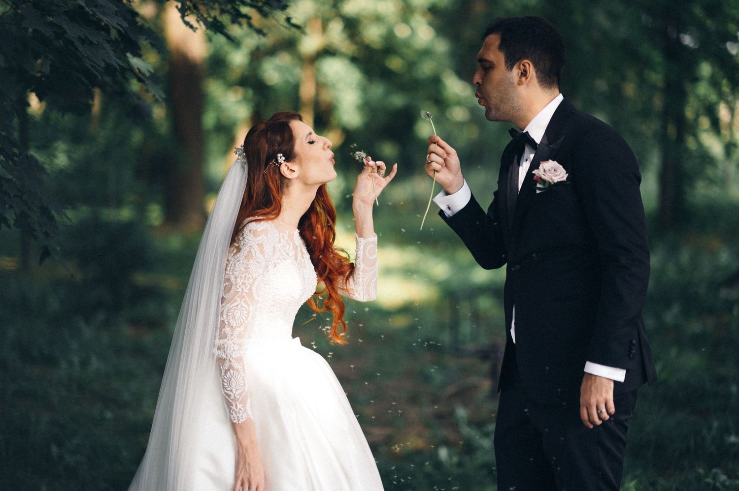A playful outdoor wedding photo showing the couple having fun and laughing together.