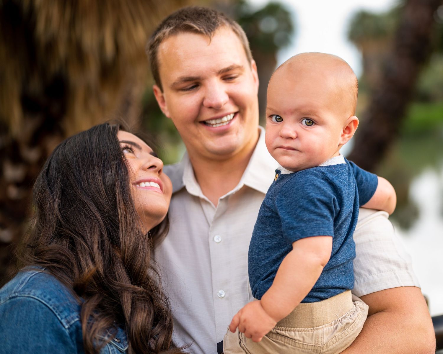 family of three at Agua Caliente Park enjoying a moment captured by Tucson Family Photographer