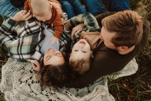 family photography in a field with their whole family