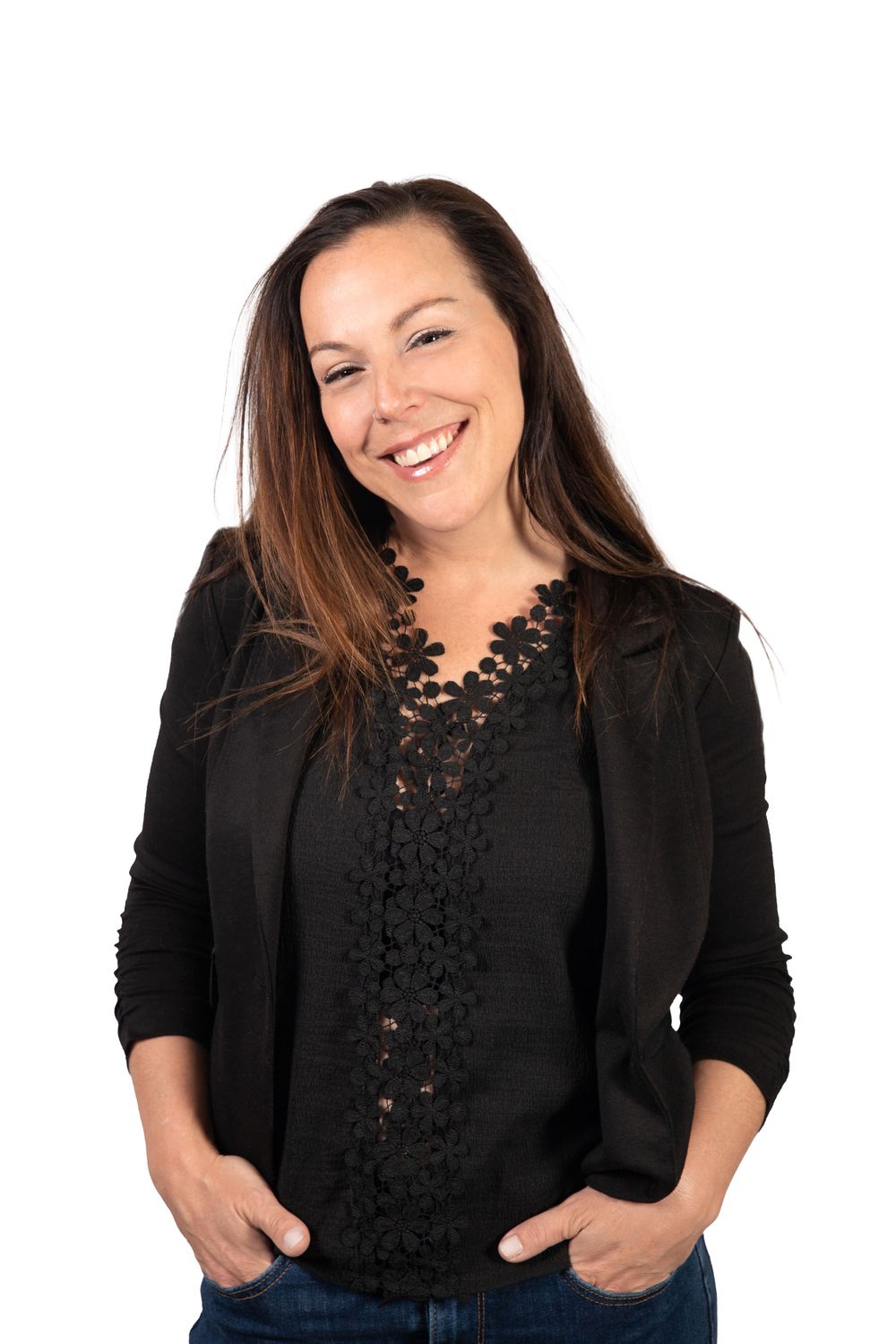Professional portraits in black lace top and blazer against white background.